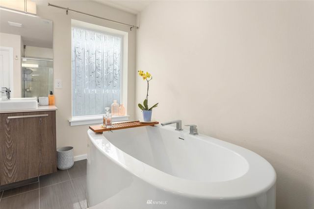 a bathroom with a bathtub and a sink