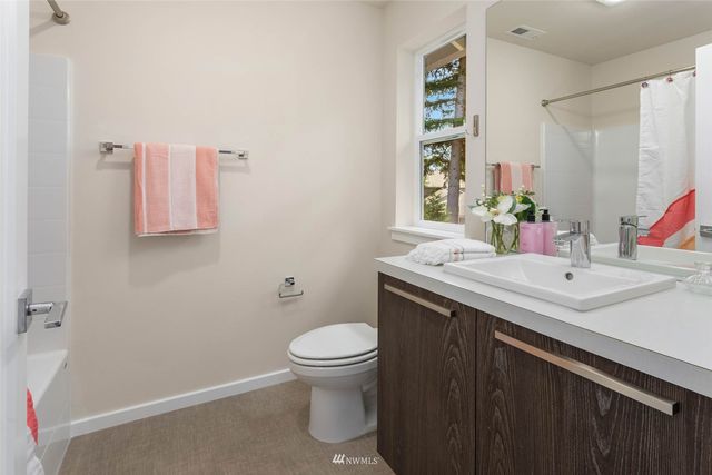 a bathroom with a sink toilet and vanity