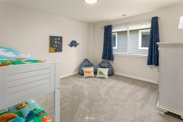 a view of room with toys and a couch