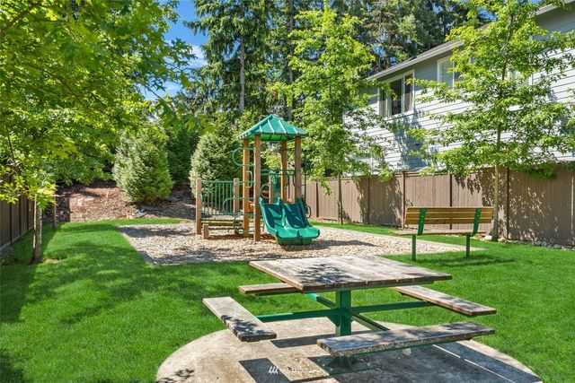 a view of a backyard with a slide