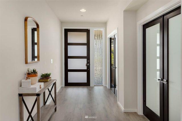a view of room with furniture and wooden floor