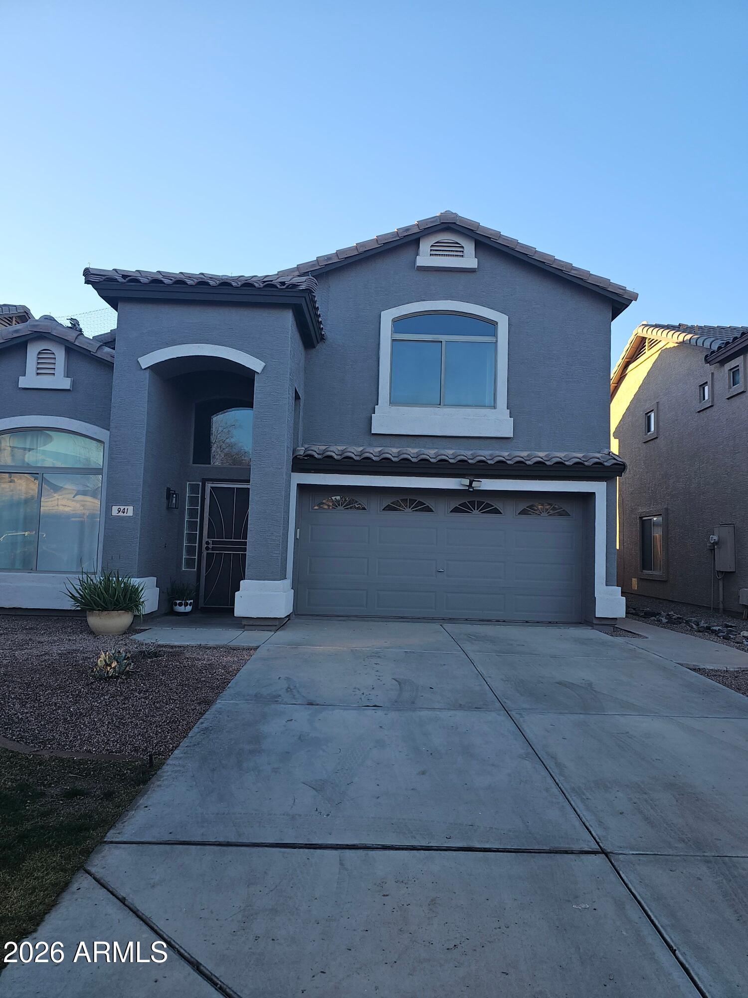 941 Mountain View Road San Tan Valley, AZ 85143 - Photo 1 of 48 a front view of a house with yard