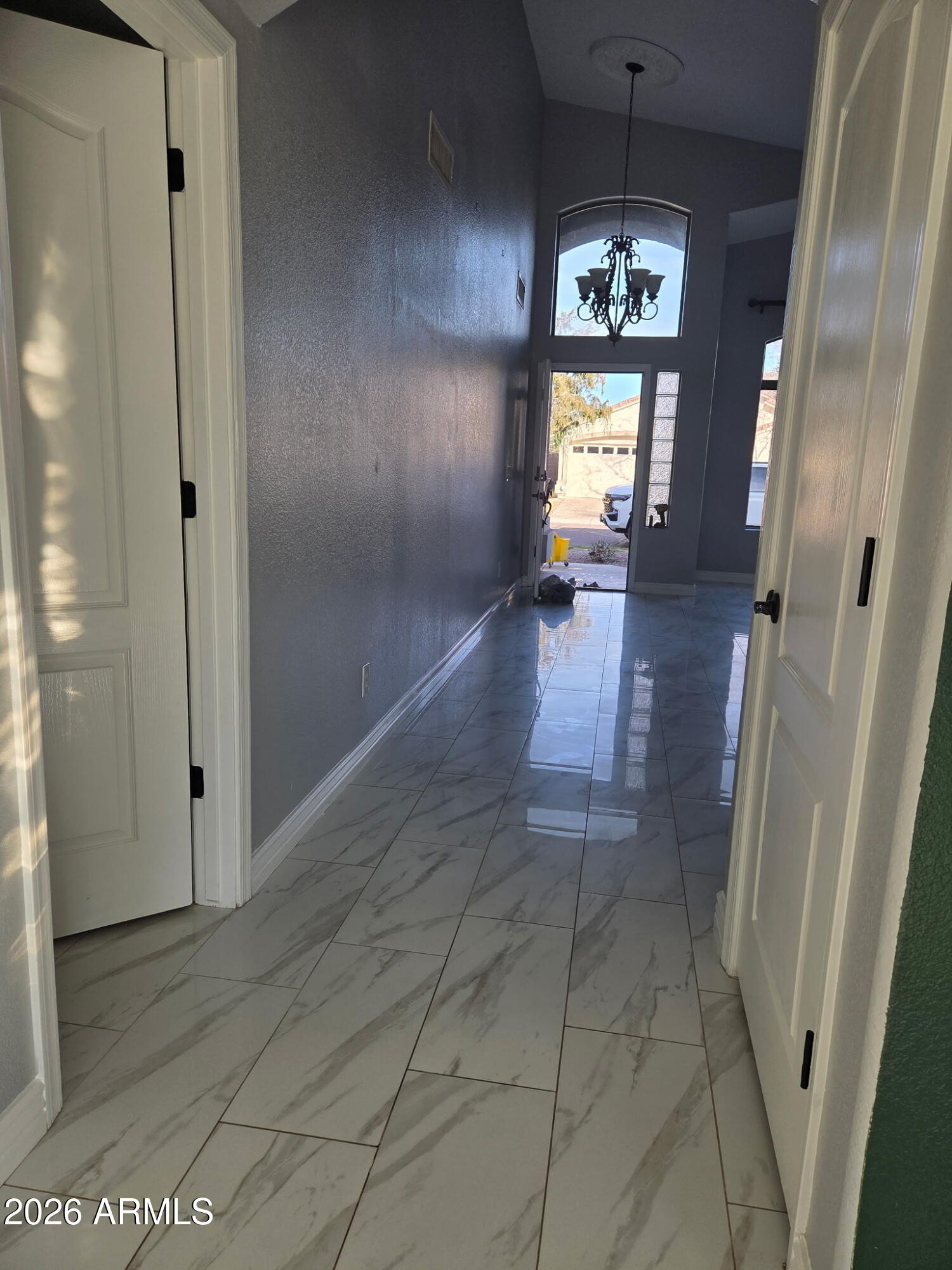941 Mountain View Road San Tan Valley, AZ 85143 - Photo 14 of 48 a view of a hallway and wooden floor with windows