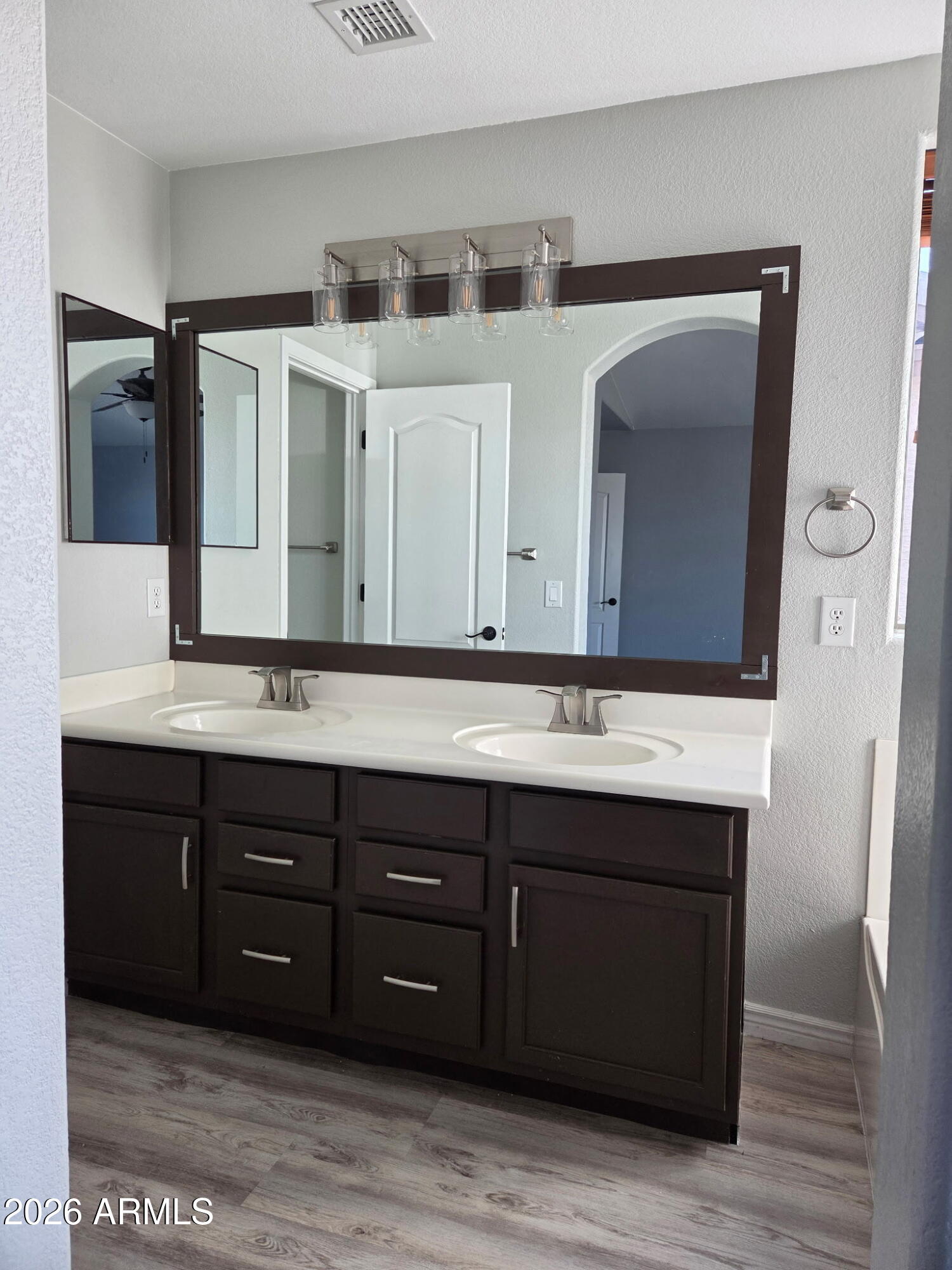 941 Mountain View Road San Tan Valley, AZ 85143 - Photo 25 of 48 a bathroom with a sink and a mirror