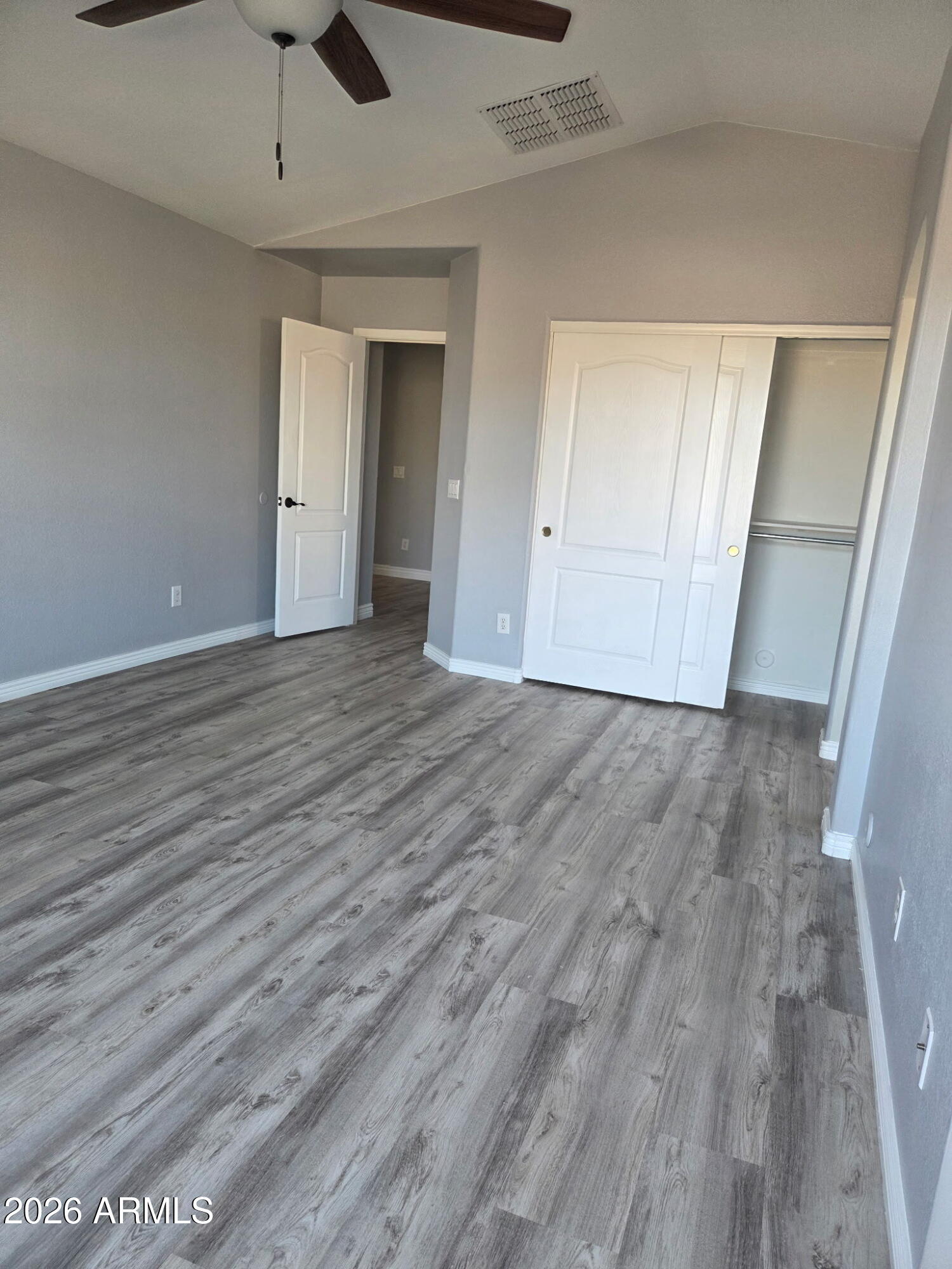 941 Mountain View Road San Tan Valley, AZ 85143 - Photo 29 of 48 wooden floor in an empty room with a window
