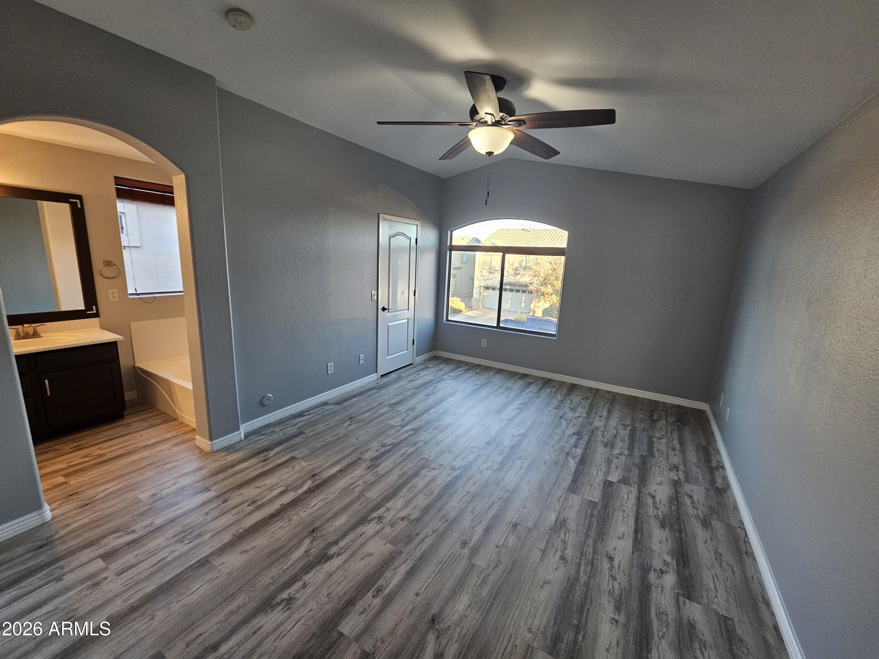 941 Mountain View Road San Tan Valley, AZ 85143 - Photo 32 of 48 wooden floor in an empty room with a window