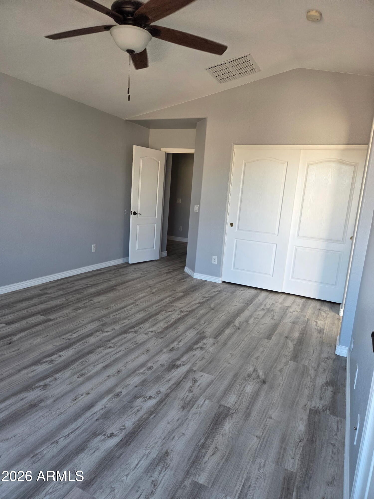941 Mountain View Road San Tan Valley, AZ 85143 - Photo 34 of 48 a view of an empty room with wooden floor