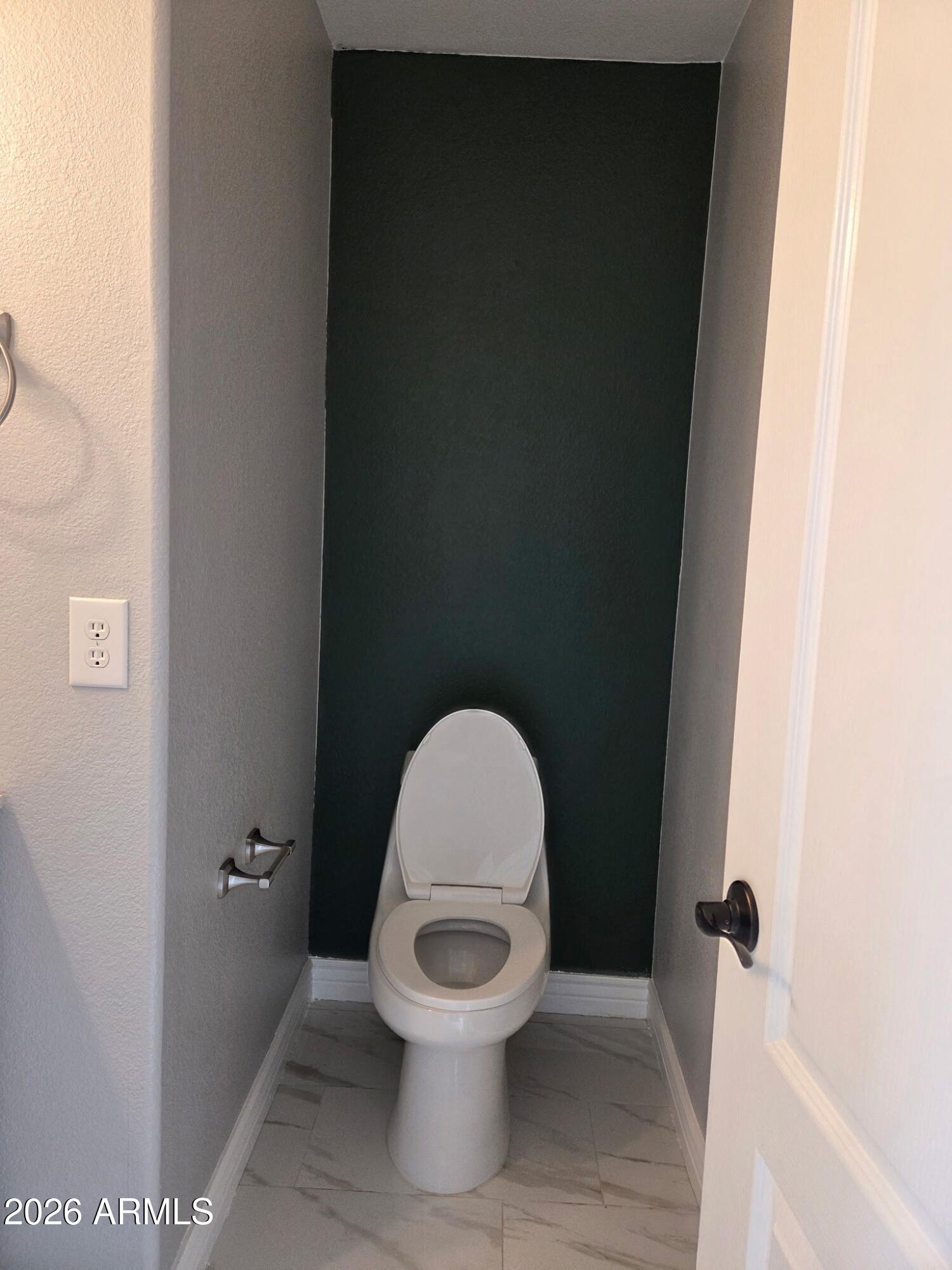 941 Mountain View Road San Tan Valley, AZ 85143 - Photo 38 of 48 a white toilet sitting in a bathroom