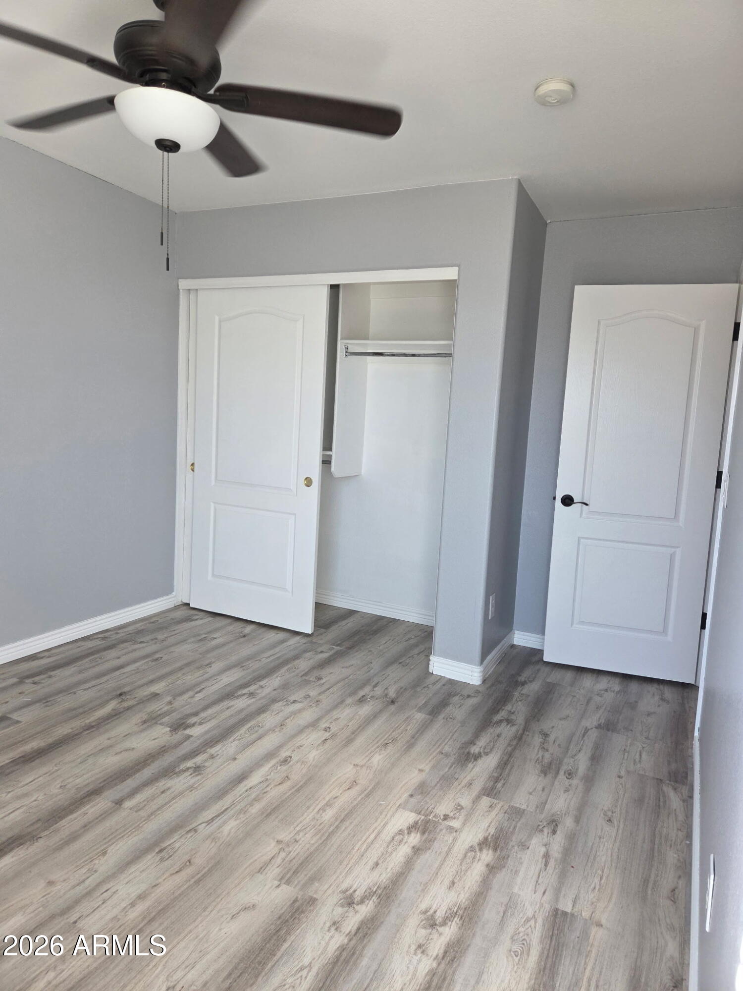 941 Mountain View Road San Tan Valley, AZ 85143 - Photo 40 of 48 wooden floor in an empty room