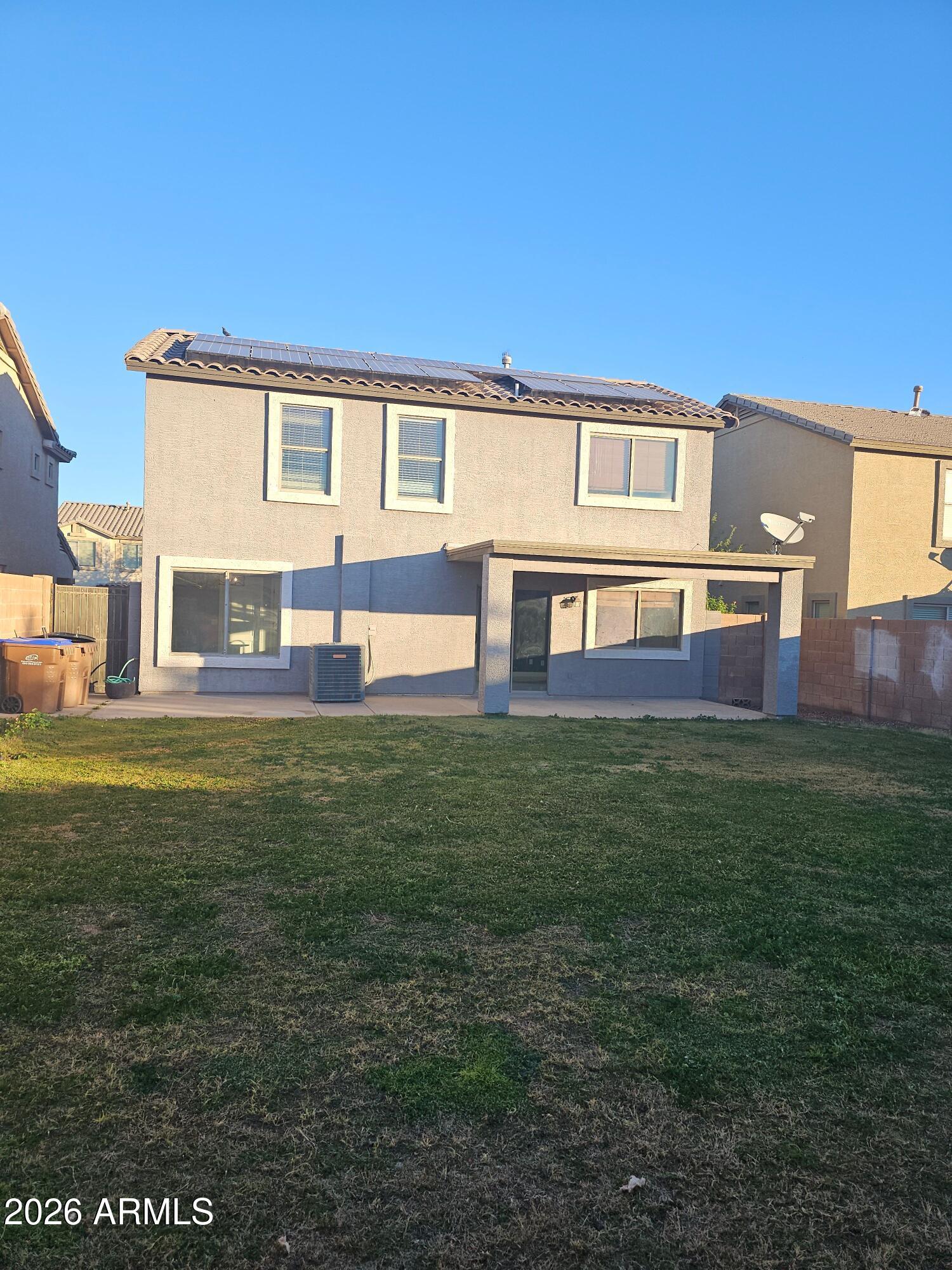 941 Mountain View Road San Tan Valley, AZ 85143 - Photo 46 of 48 a view of a house with a backyard