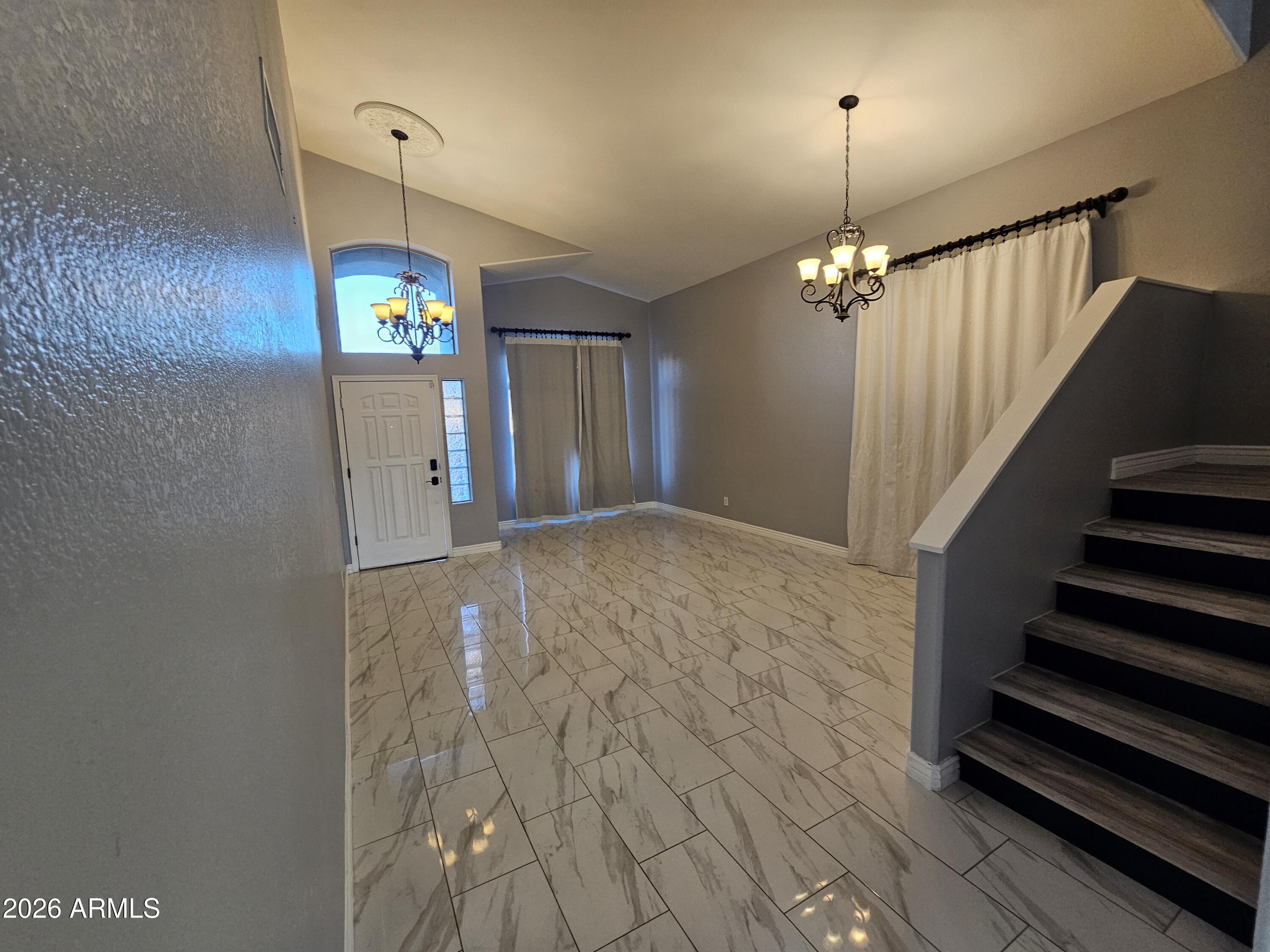 941 Mountain View Road San Tan Valley, AZ 85143 - Photo 8 of 48 an empty room with stairs and wooden floor