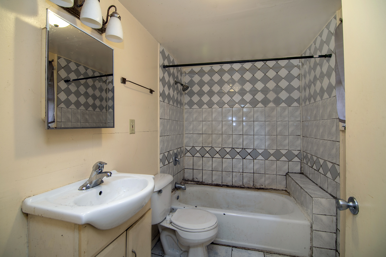 1990 Patrick Avenue Kankakee, IL 60901 - Photo 15 of 15 a bathroom with a sink a toilet and shower