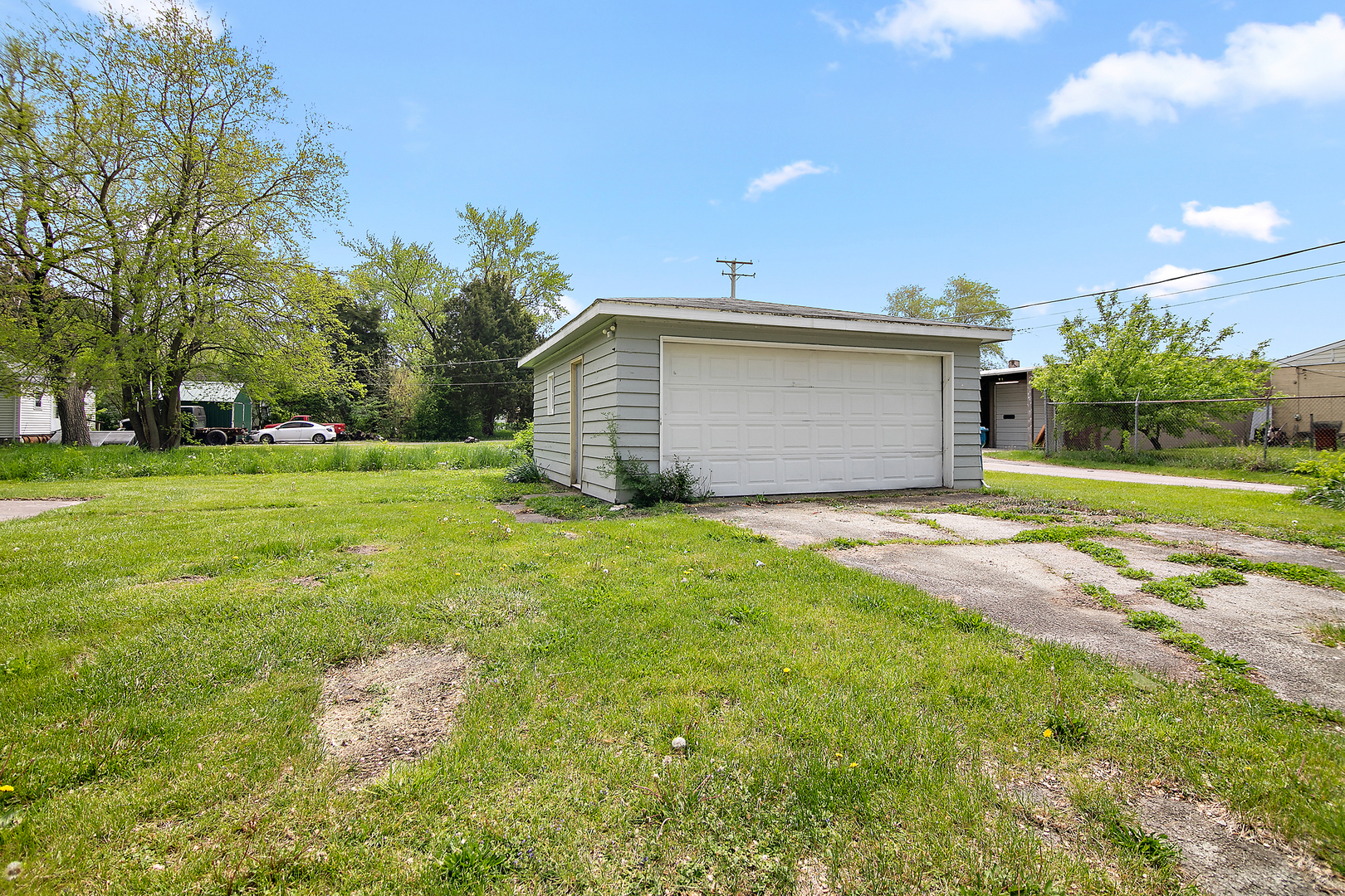1990 Patrick Avenue Kankakee, IL 60901 - Photo 3 of 15 a view of a house with a yard and garage