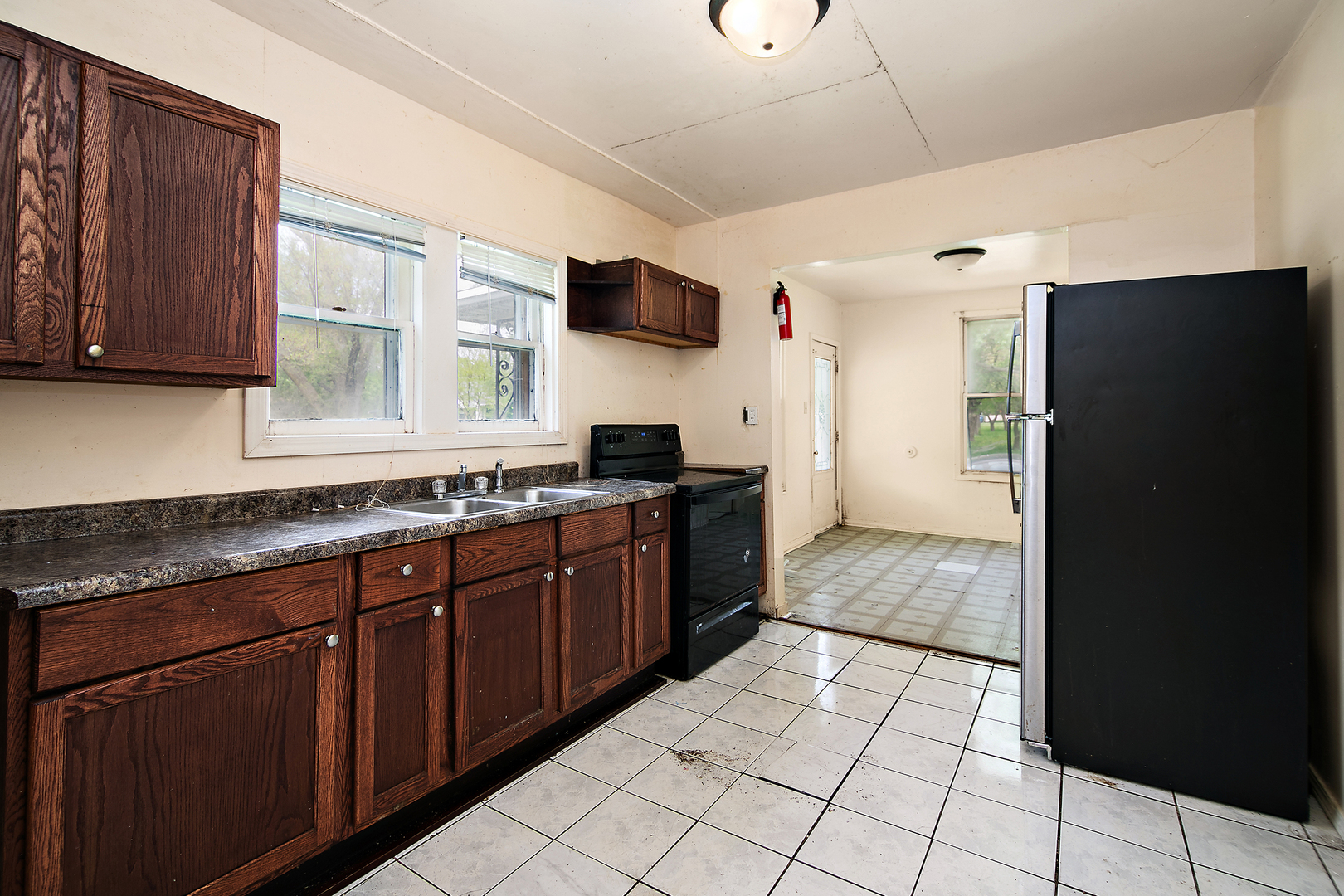 1990 Patrick Avenue Kankakee, IL 60901 - Photo 5 of 15 a large kitchen with stainless steel appliances granite countertop a refrigerator and a stove top oven