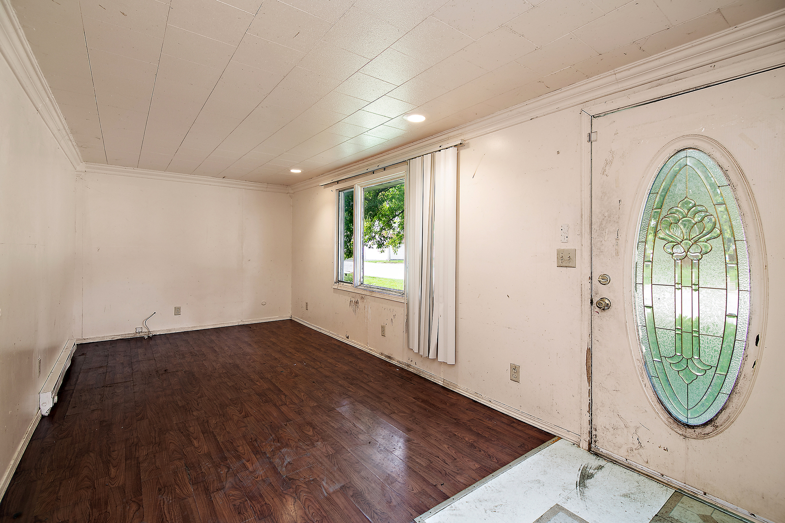 1990 Patrick Avenue Kankakee, IL 60901 - Photo 7 of 15 an entryway with wooden floor windows and plants