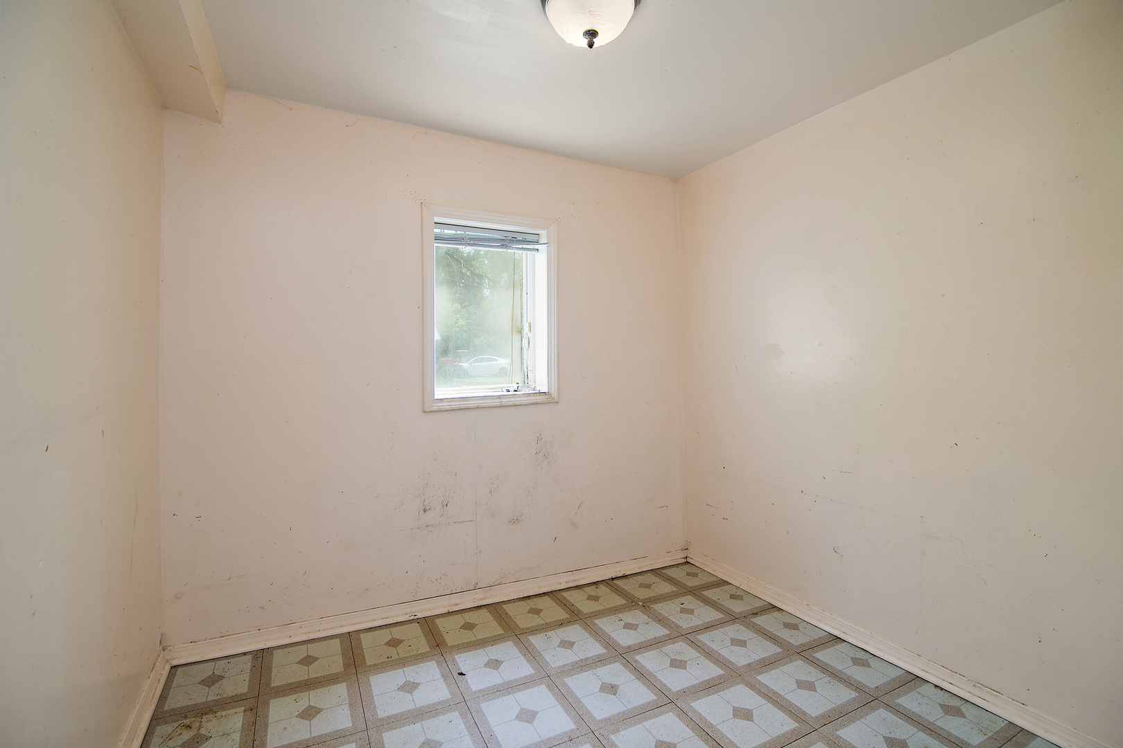 1990 Patrick Avenue Kankakee, IL 60901 - Photo 9 of 15 an empty room with a window