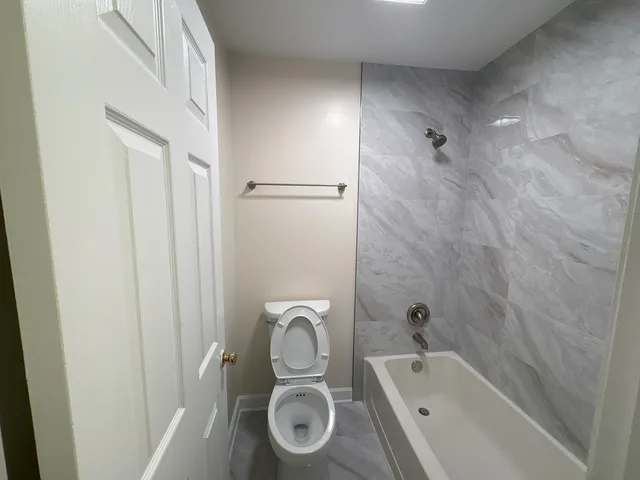 a bathroom with a tub and sink