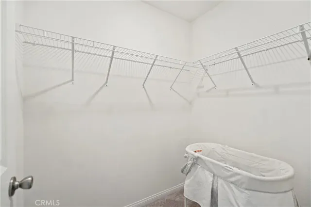 a bedroom with a bed and cabinets