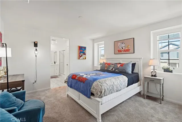 a bedroom with a bed and furniture