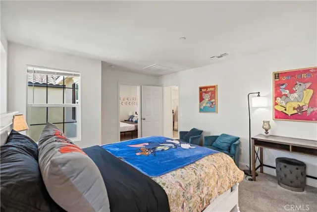 a view of a hallway with wooden floor and entryway