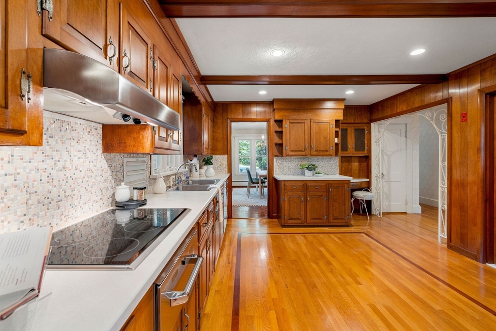 36 Independence Avenue Lexington, MA 02420 - Photo 11 of 33 a kitchen with stainless steel appliances granite countertop a sink a stove and a wooden floors