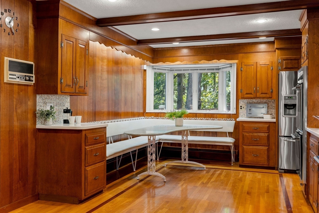 36 Independence Avenue Lexington, MA 02420 - Photo 16 of 33 a kitchen with stainless steel appliances a stove and a refrigerator