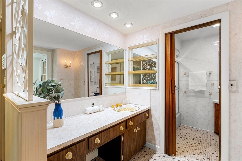 36 Independence Avenue Lexington, MA 02420 - Photo 20 of 33 a spacious bathroom with a granite countertop sink mirror and shower