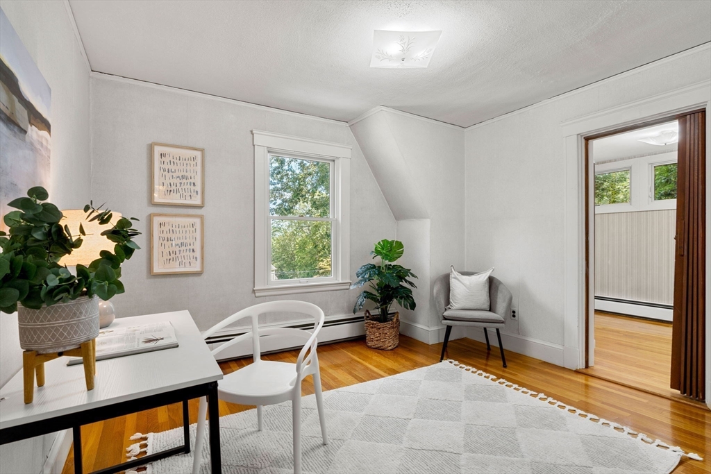36 Independence Avenue Lexington, MA 02420 - Photo 25 of 33 a living room with furniture a window and a potted plant