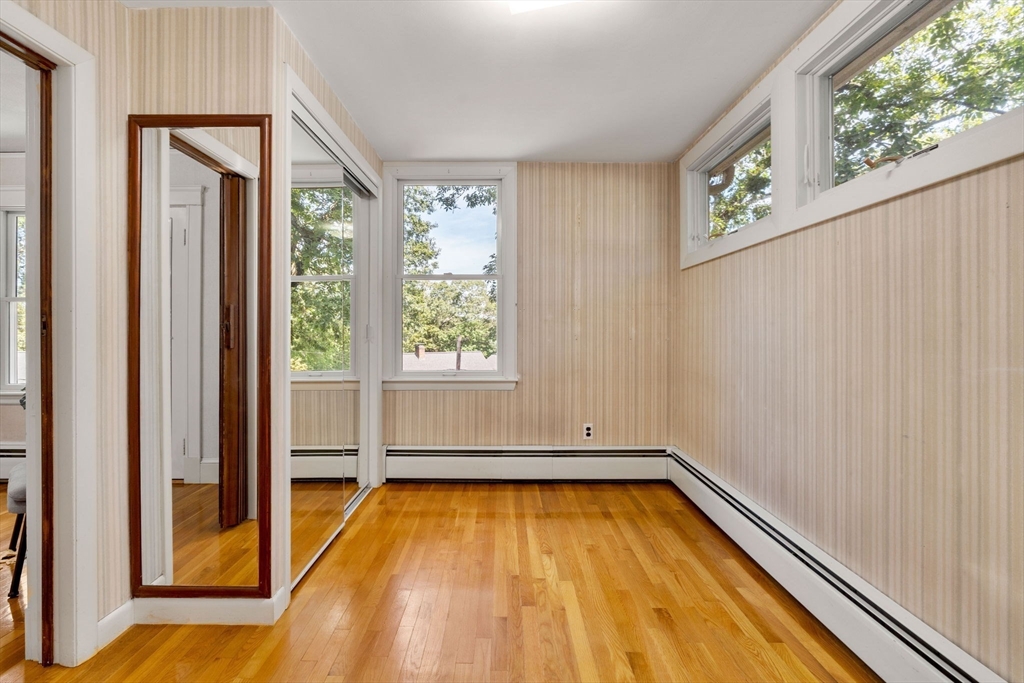 36 Independence Avenue Lexington, MA 02420 - Photo 27 of 33 a view of a room with wooden floor and small window