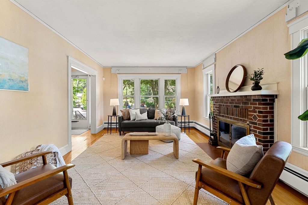 36 Independence Avenue Lexington, MA 02420 - Photo 5 of 33 a living room with furniture and a fireplace