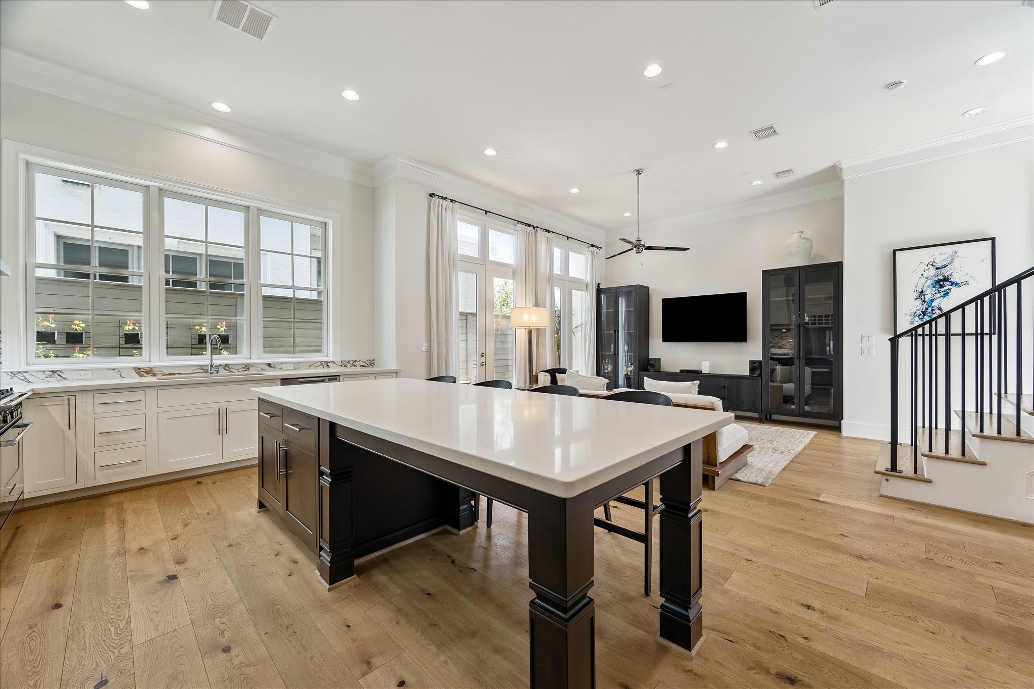 6108 Nicholas Grove Place Houston, TX 77055 - Photo 5 of 29 Always the gathering spot for family and friends, the uninterrupted island serves as the dining area too.