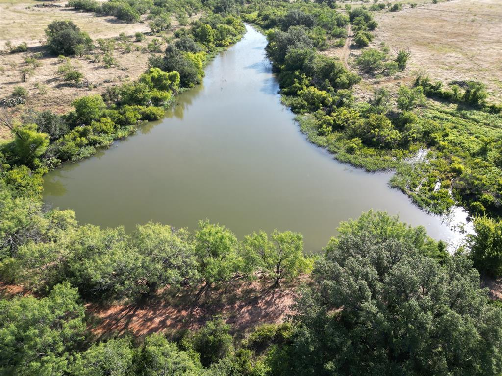 107 County Road 107 Cisco, TX 76437 - Photo 3 of 40 an aerial view of a house with a yard and lake view