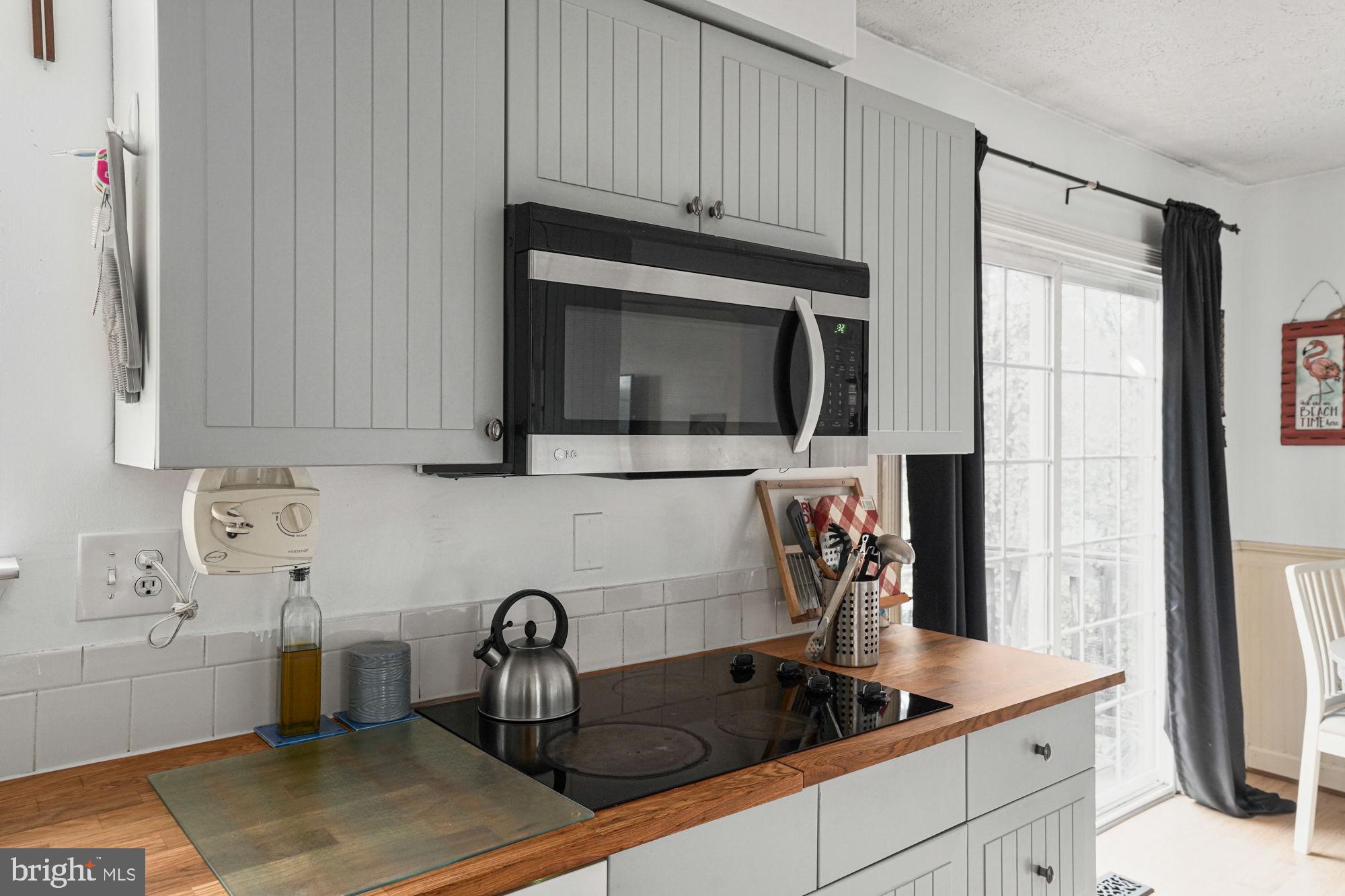 38 Buck Road Stafford, VA 22556 - Photo 13 of 39 a kitchen with stainless steel appliances granite countertop a sink and a microwave