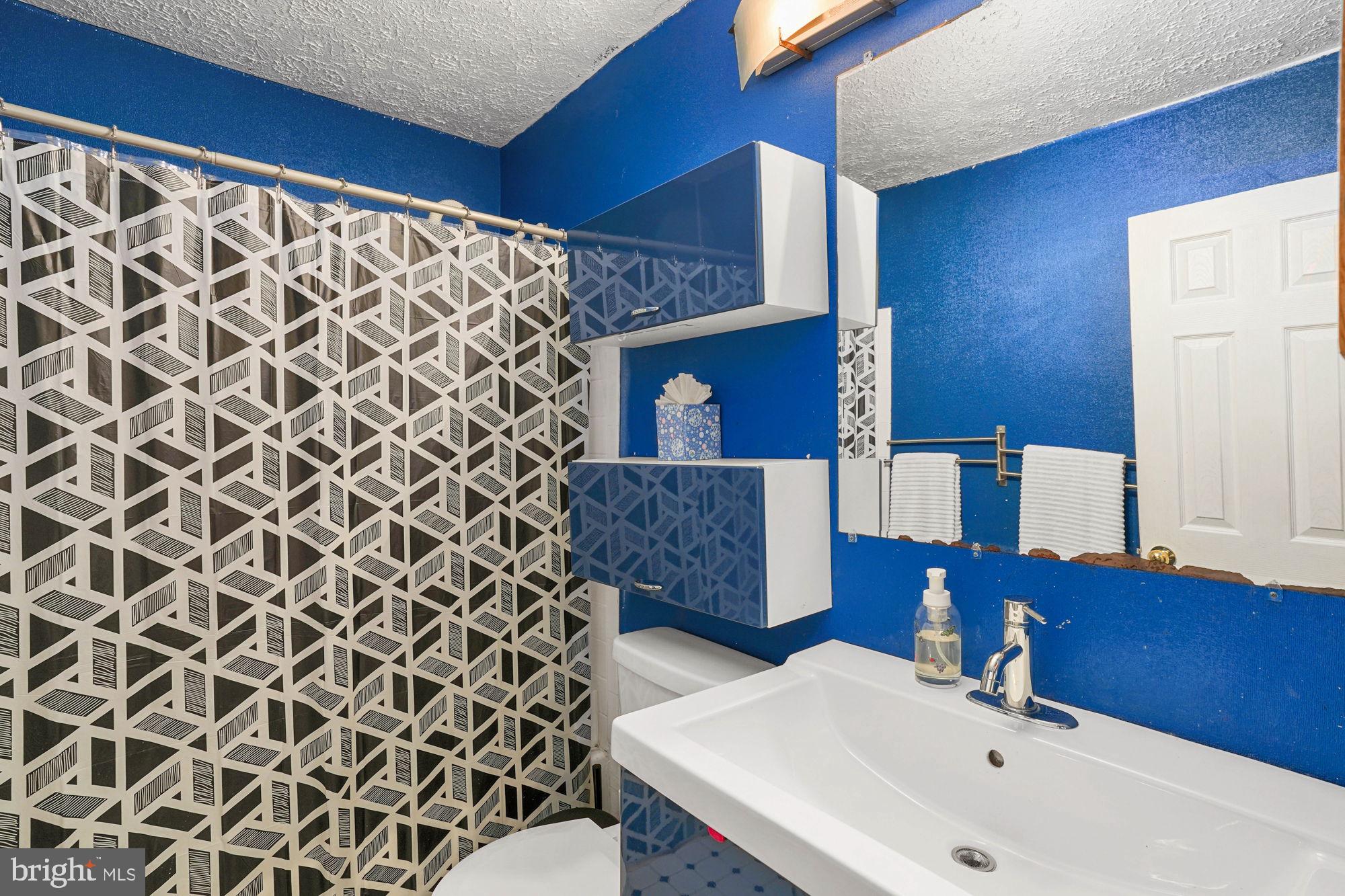 38 Buck Road Stafford, VA 22556 - Photo 18 of 39 a bathroom with a sink and a mirror