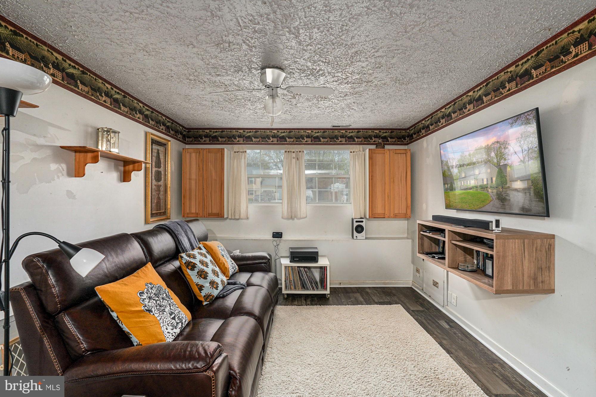 38 Buck Road Stafford, VA 22556 - Photo 26 of 39 a living room with furniture and a flat screen tv