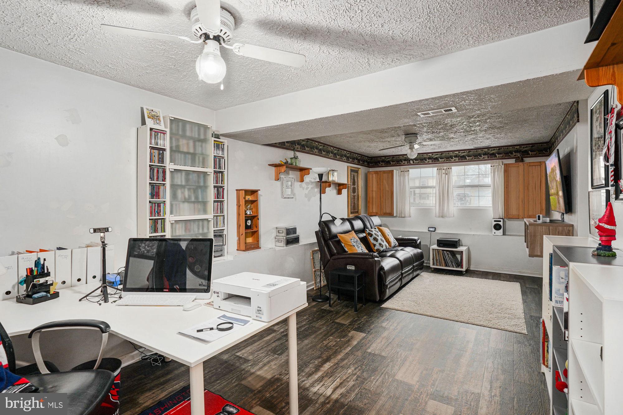 38 Buck Road Stafford, VA 22556 - Photo 28 of 39 a living room with furniture and a chandelier