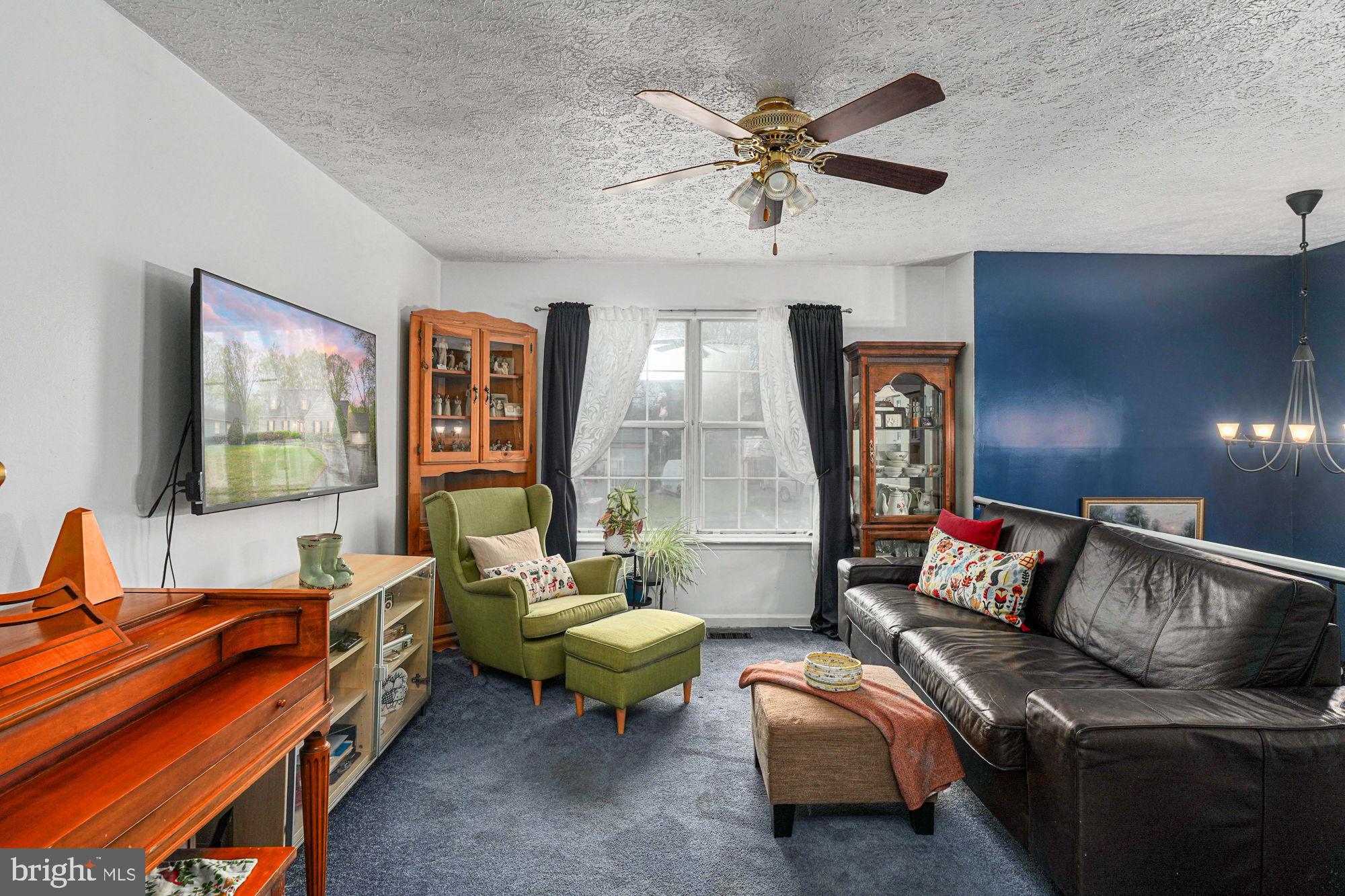 38 Buck Road Stafford, VA 22556 - Photo 5 of 39 a living room with furniture and a flat screen tv