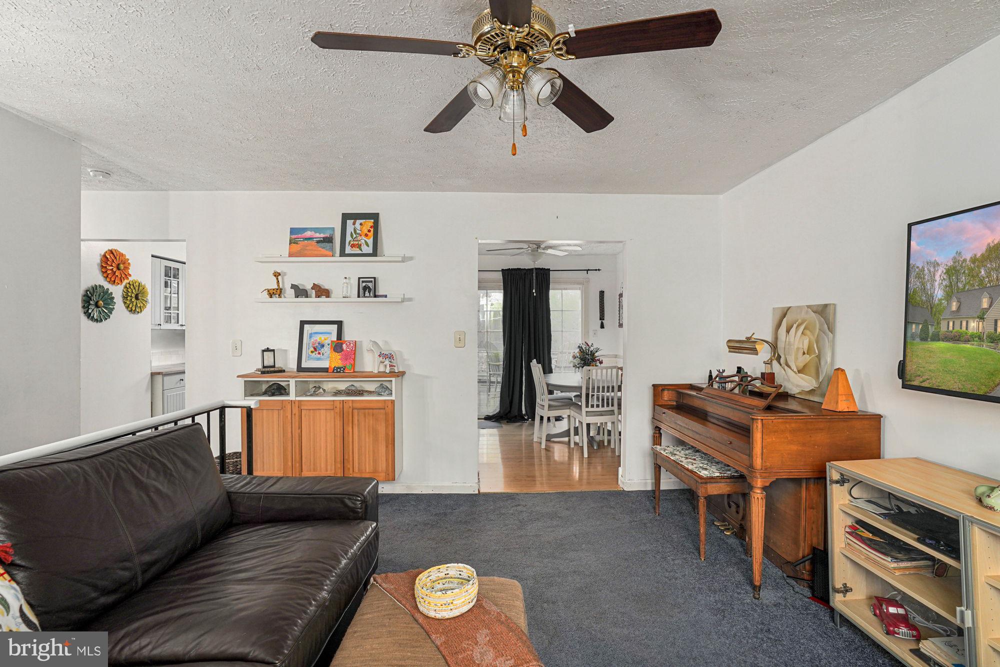 38 Buck Road Stafford, VA 22556 - Photo 7 of 39 a living room with furniture and a flat screen tv