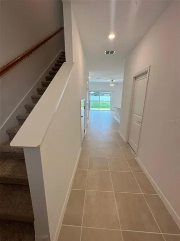 a view of hallway with stairs