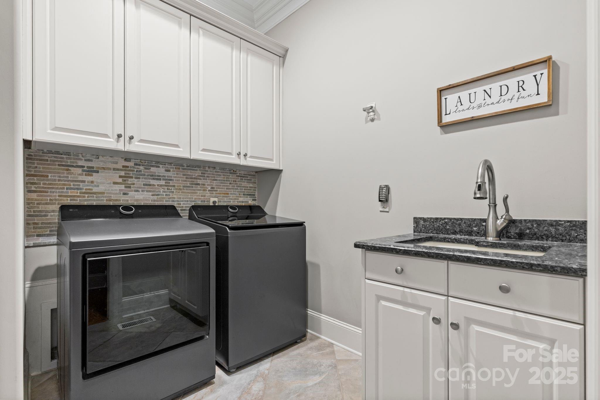 143 Greenbay Road Mooresville, NC 28117 - Photo 17 of 46 a kitchen with granite countertop white cabinets and white appliances