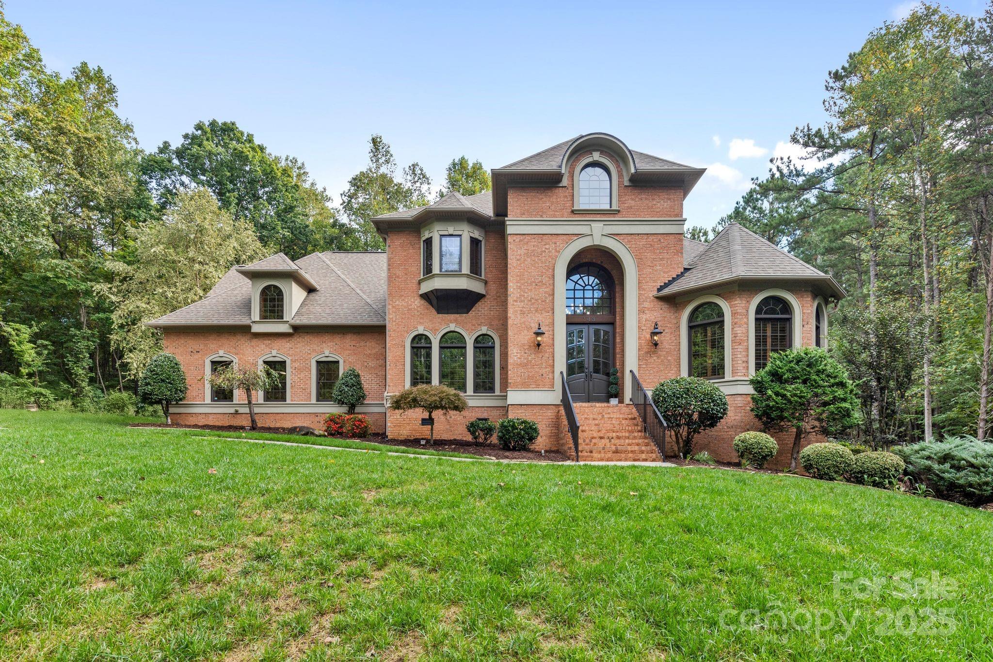 143 Greenbay Road Mooresville, NC 28117 - Photo 2 of 46 a front view of a house with garden
