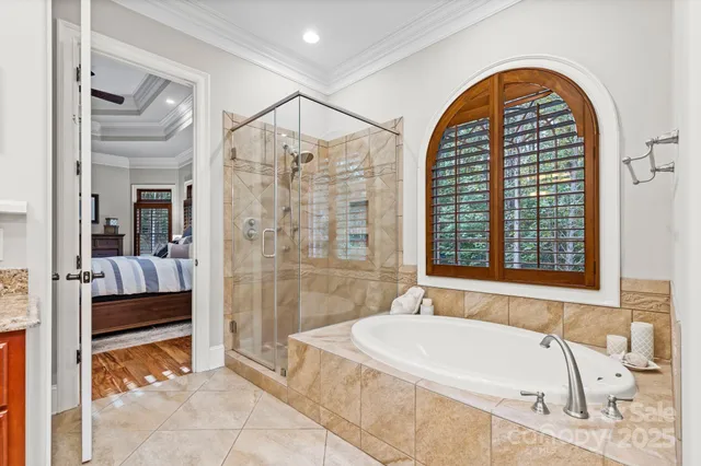 a spacious bathroom with a tub and shower
