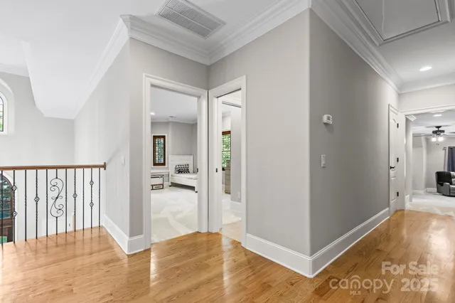 a view of a hallway view with wooden floor and dining room