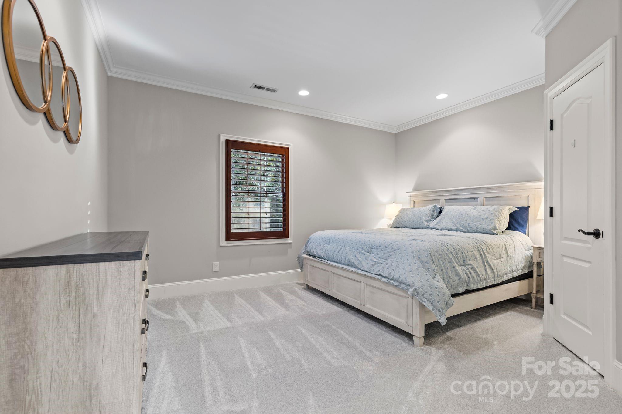 143 Greenbay Road Mooresville, NC 28117 - Photo 27 of 46 a bedroom with a large bed and a window