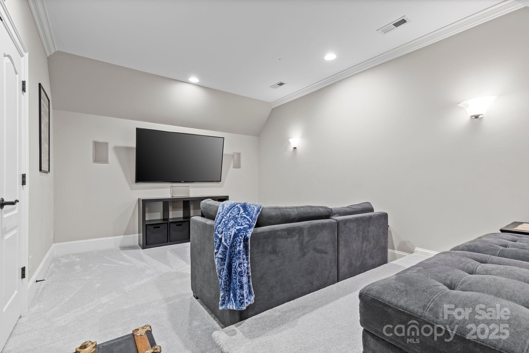 143 Greenbay Road Mooresville, NC 28117 - Photo 35 of 46 a living room with furniture and a flat screen tv