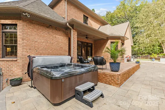 an aerial view of residential house with outdoor space and lake view