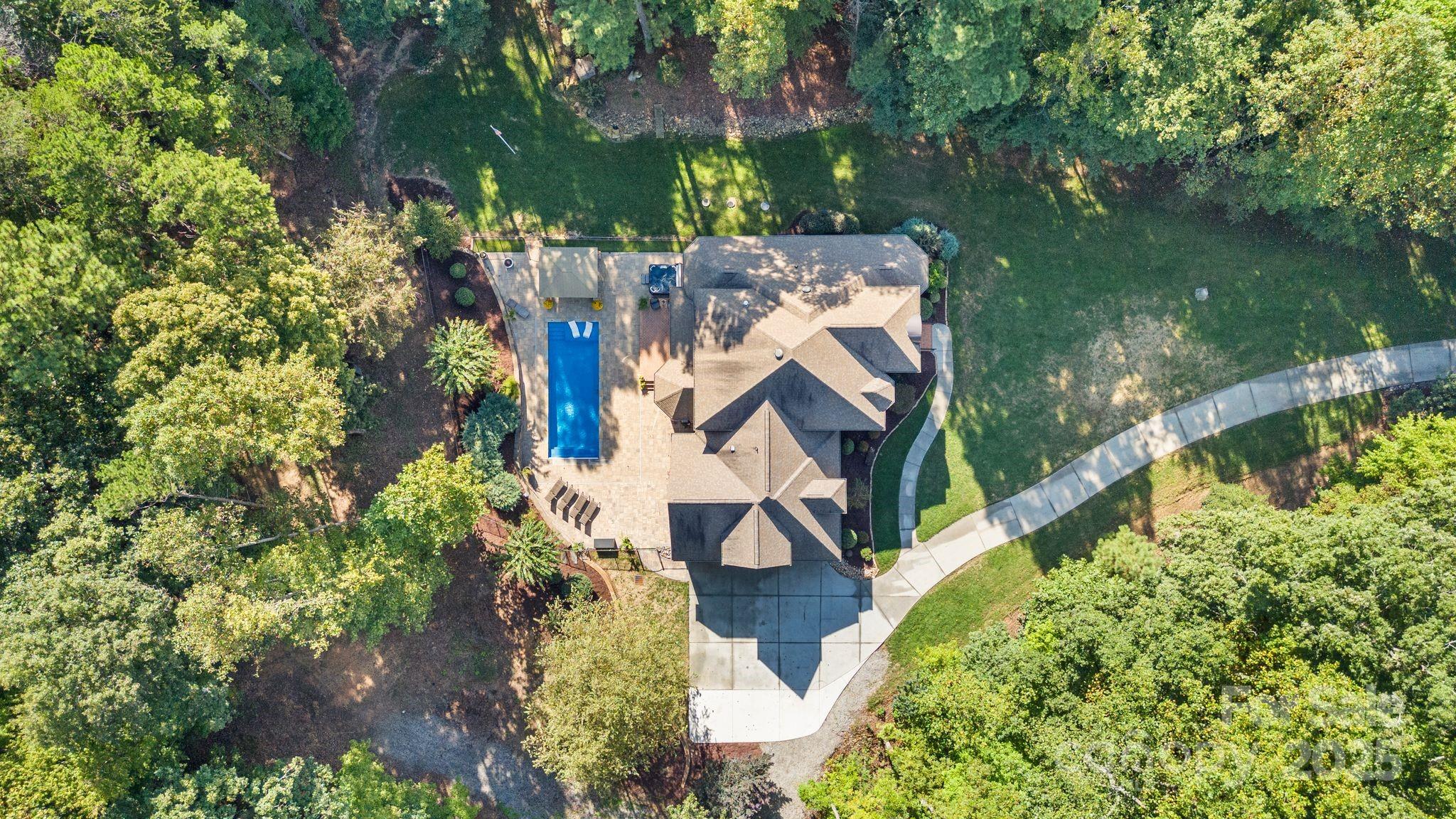 143 Greenbay Road Mooresville, NC 28117 - Photo 46 of 46 an aerial view of residential house with outdoor space and lake view