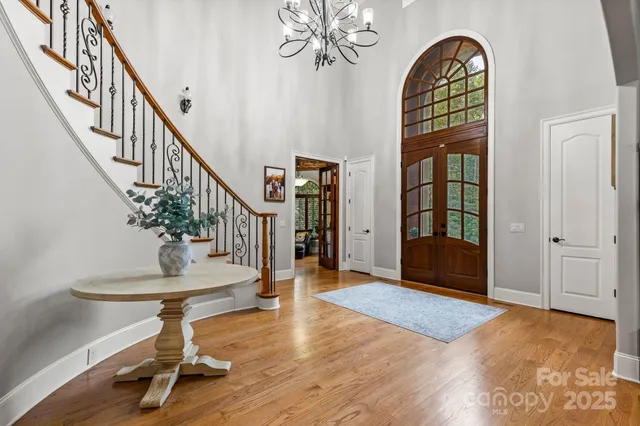 a view of entryway with wooden floor and stairs