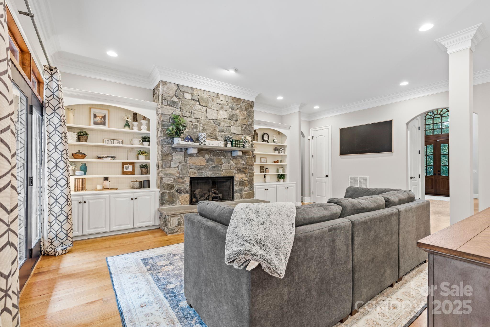 143 Greenbay Road Mooresville, NC 28117 - Photo 9 of 46 a living room with furniture and a fireplace