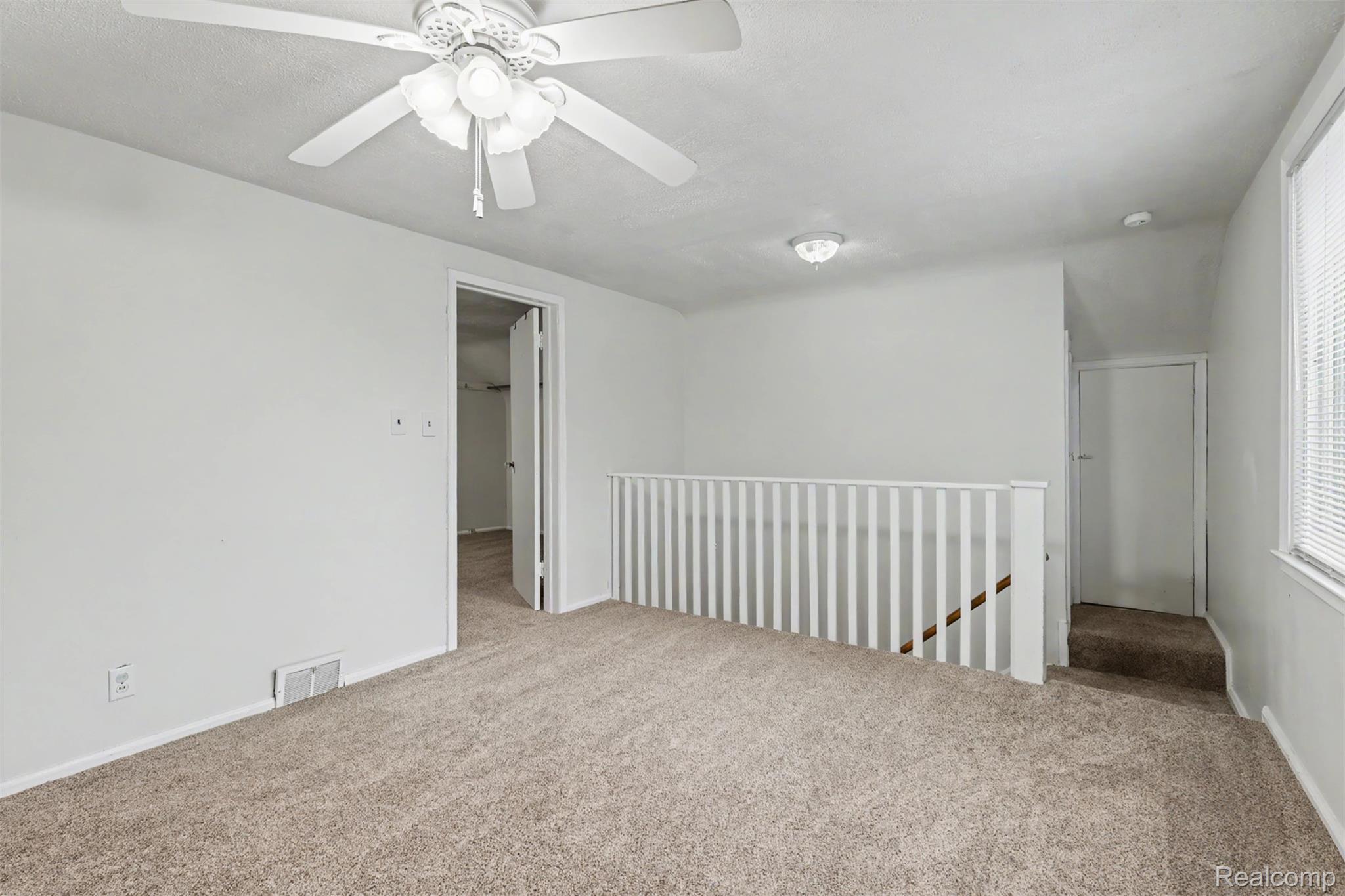 7136 Rosedale Boulevard Allen Park, MI 48101 - Photo 32 of 51 Plush carpet flooring, ceiling fan with integrated lighting, recessed lighting, white wall finishes, and a window with blinds